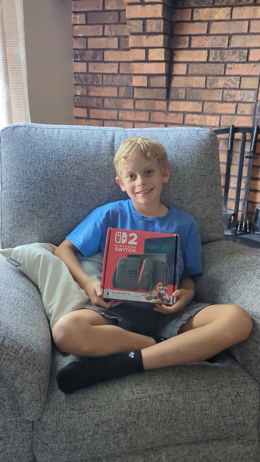 Malachi holding his new Nintendo Switch 2 box